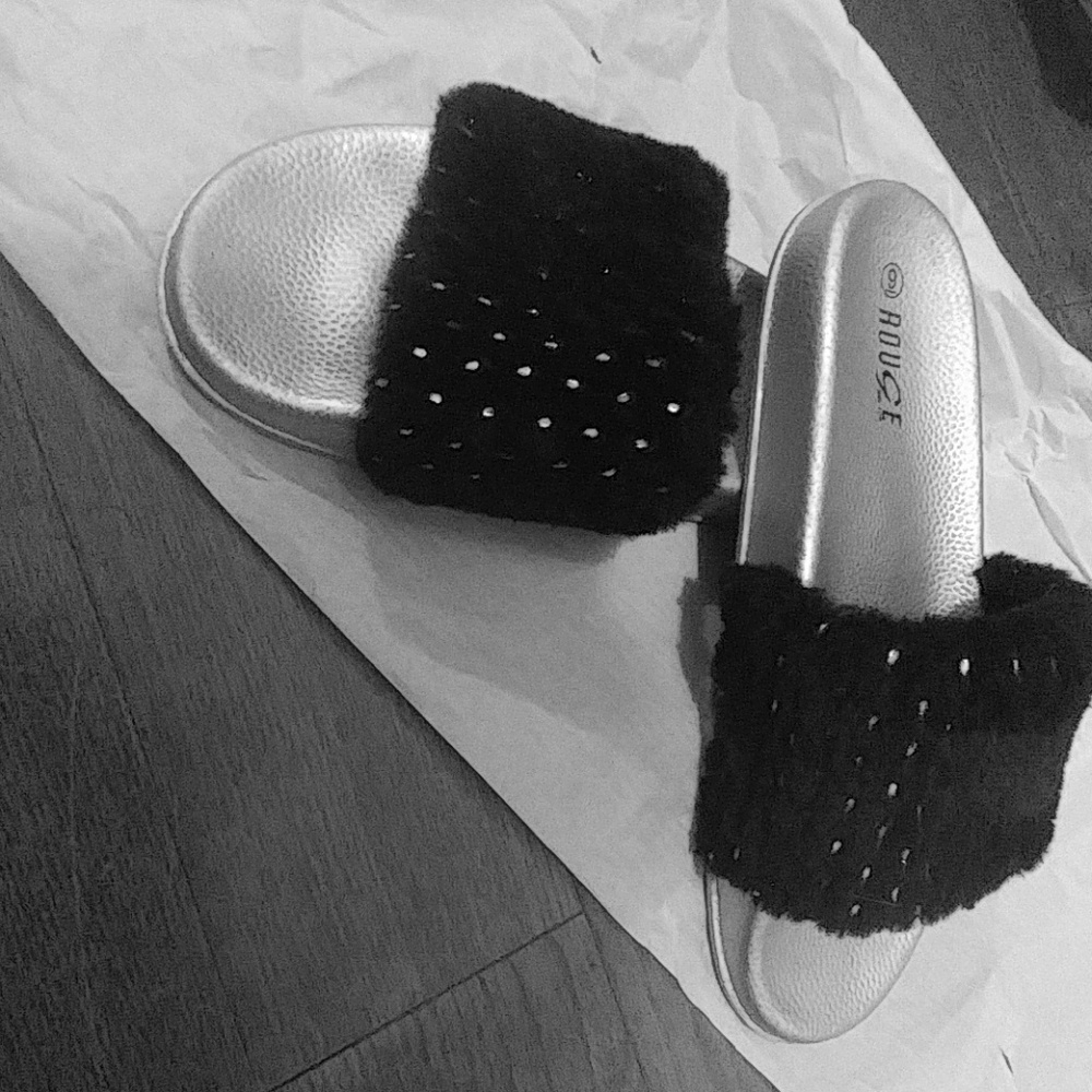 A pair of sandals/slides